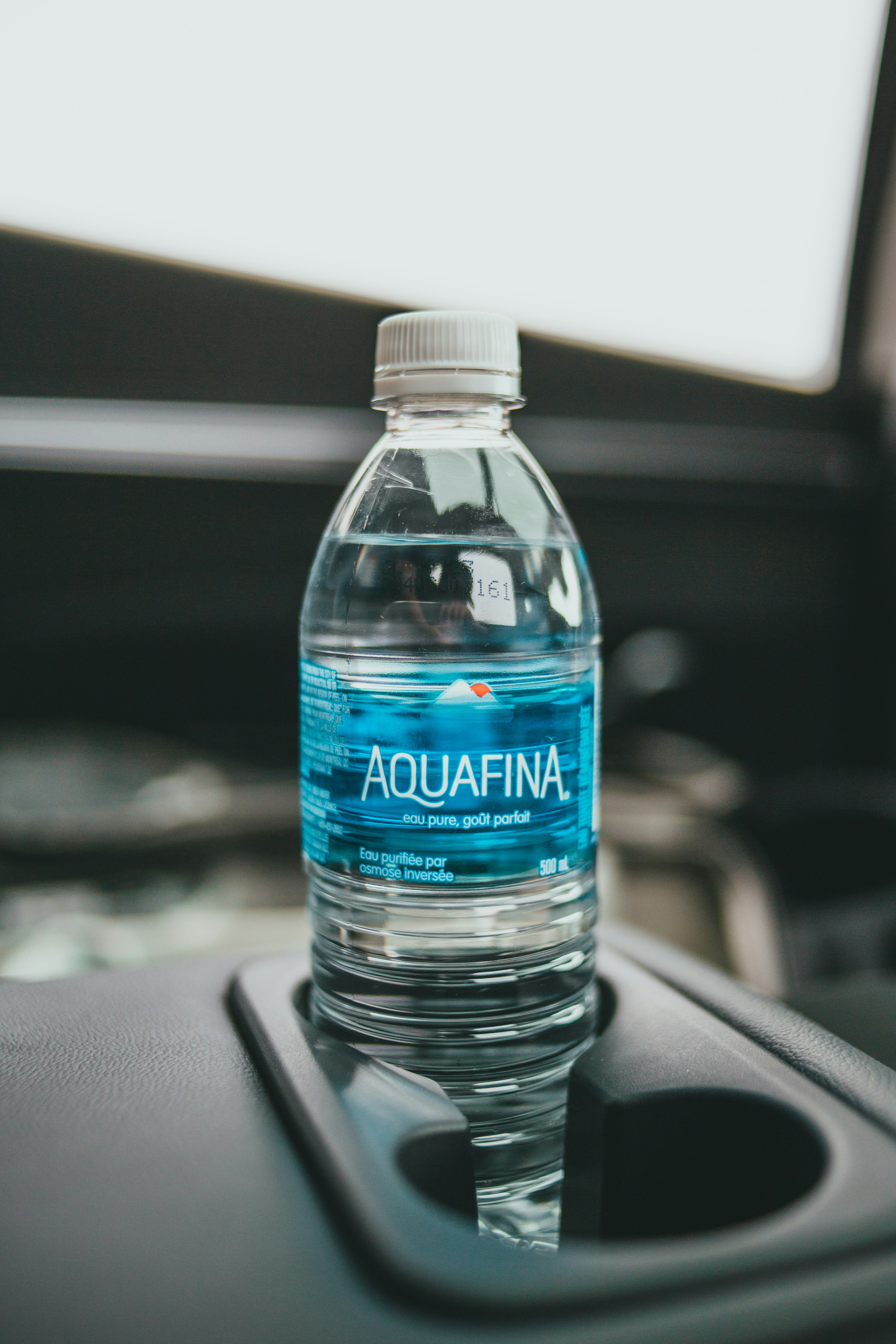 purified water bottle on car seat